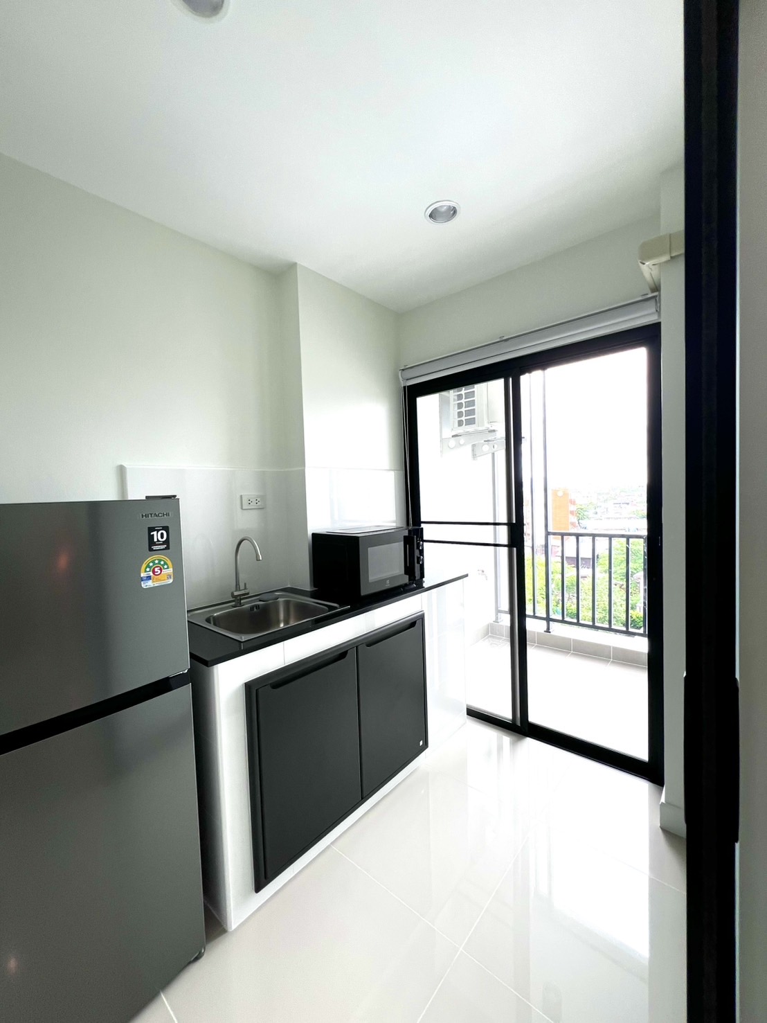 Pantry area with counter and sink